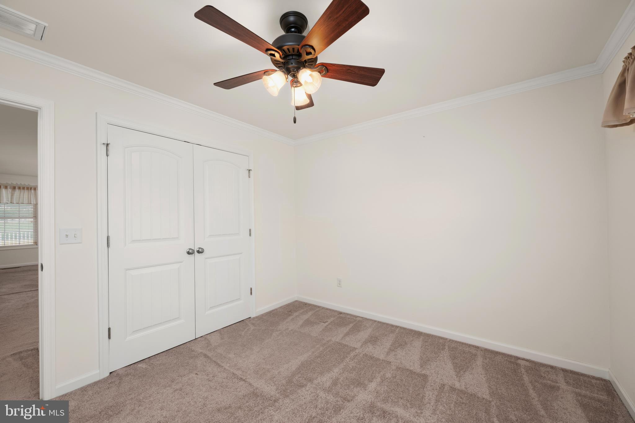 17002 Oak Road Bridgeville, DE 19933 - Photo 21 of 33 an empty room with a window and a fan