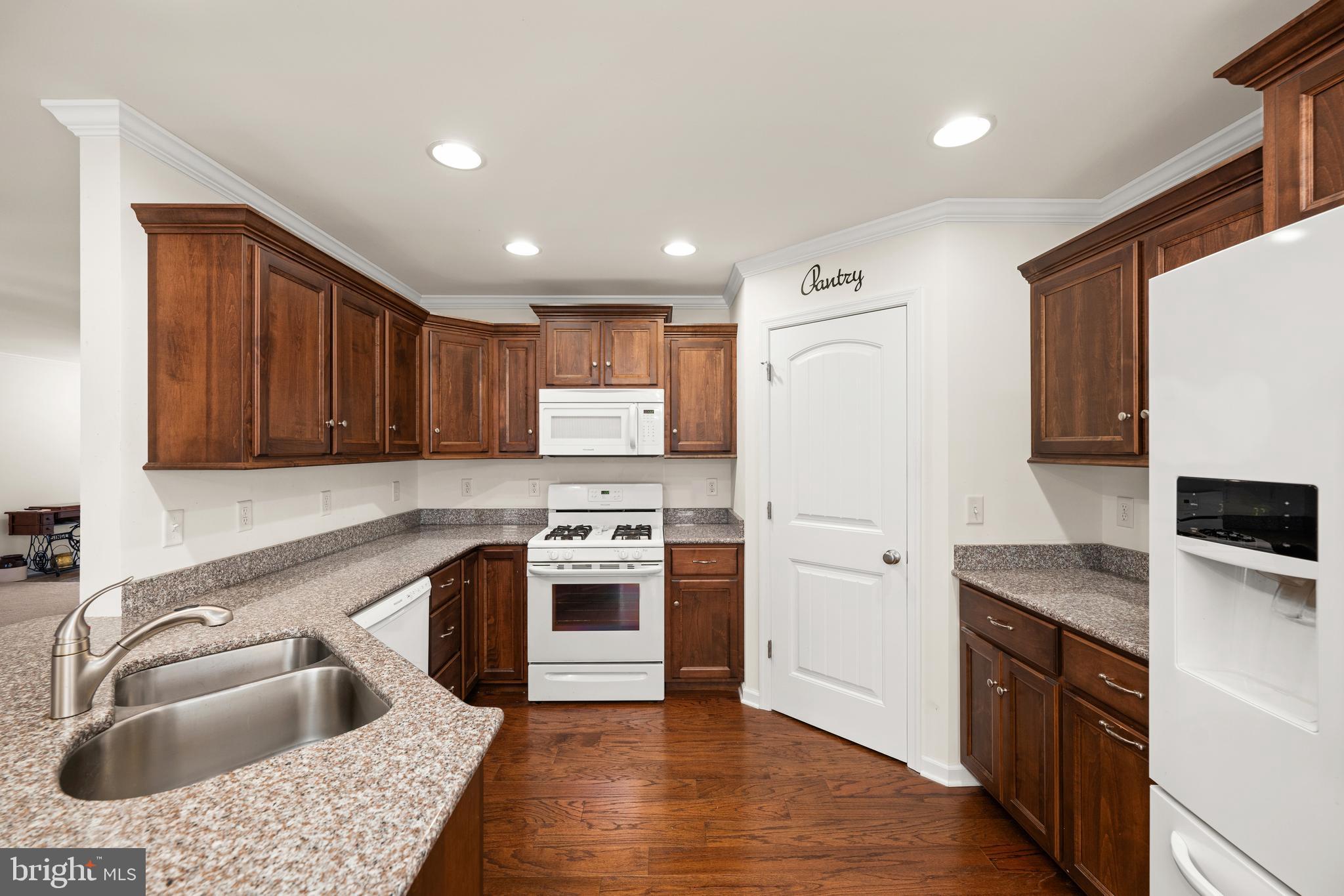17002 Oak Road Bridgeville, DE 19933 - Photo 7 of 33 a kitchen with stainless steel appliances granite countertop a sink stove and refrigerator