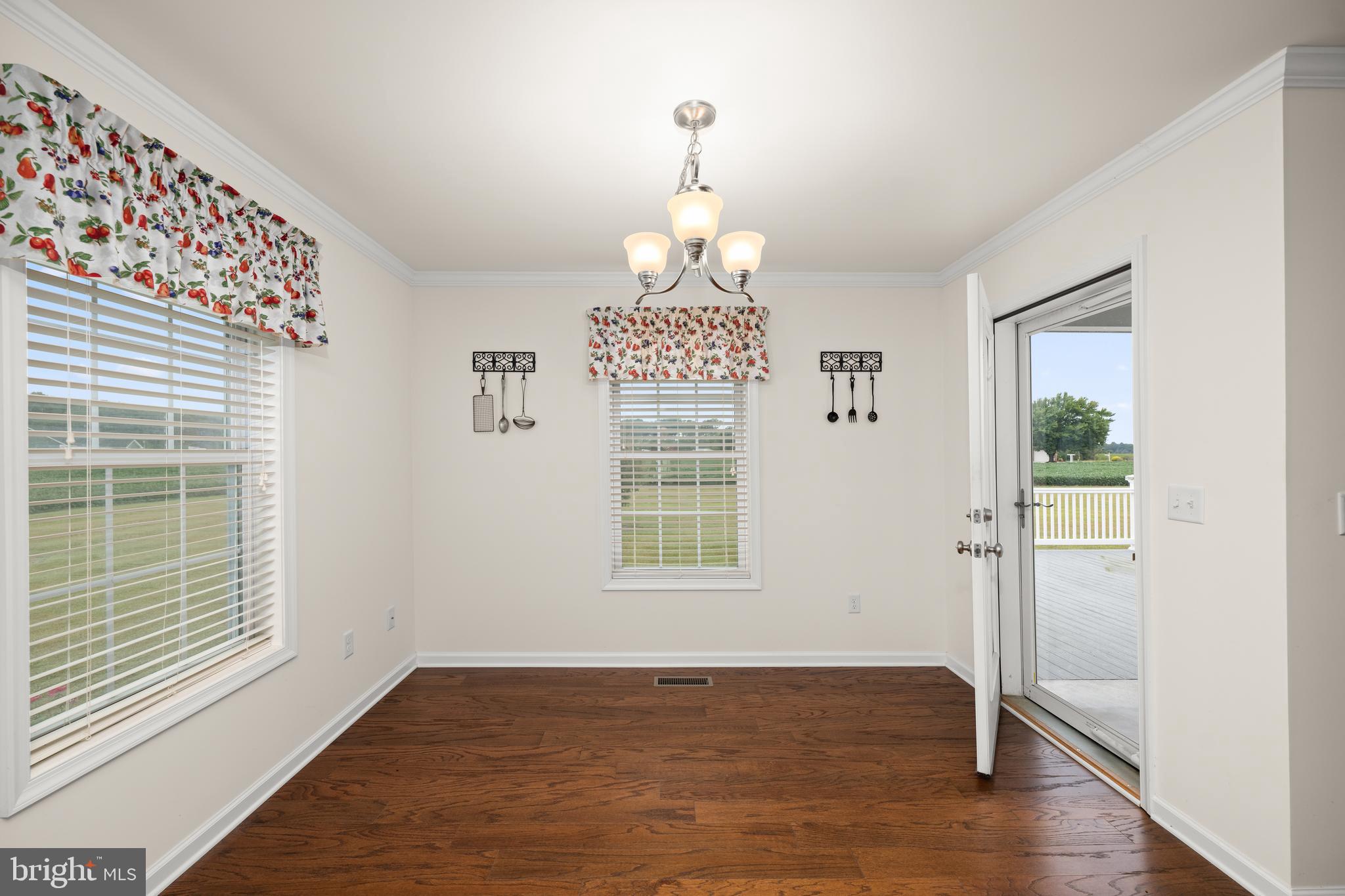 17002 Oak Road Bridgeville, DE 19933 - Photo 10 of 33 a view of an empty room with wooden floor and a window