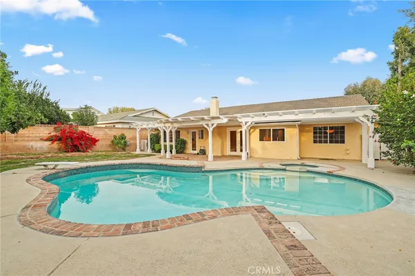 a view of a house with a swimming pool