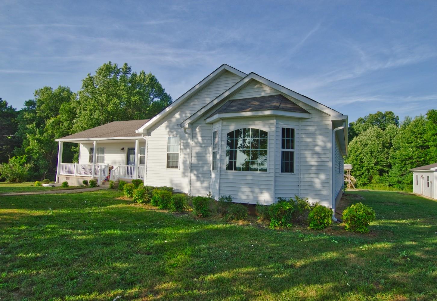986 McClain Road Morrison, TN 37357 - Photo 1 of 19 a front view of a house with a yard