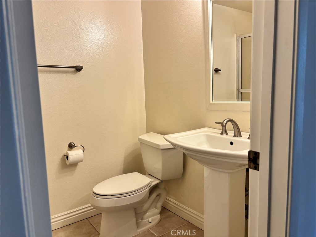 81 Stanford Court, Unit 67 Irvine, CA 92612 - Photo 16 of 30 a bathroom with a sink and a toilet