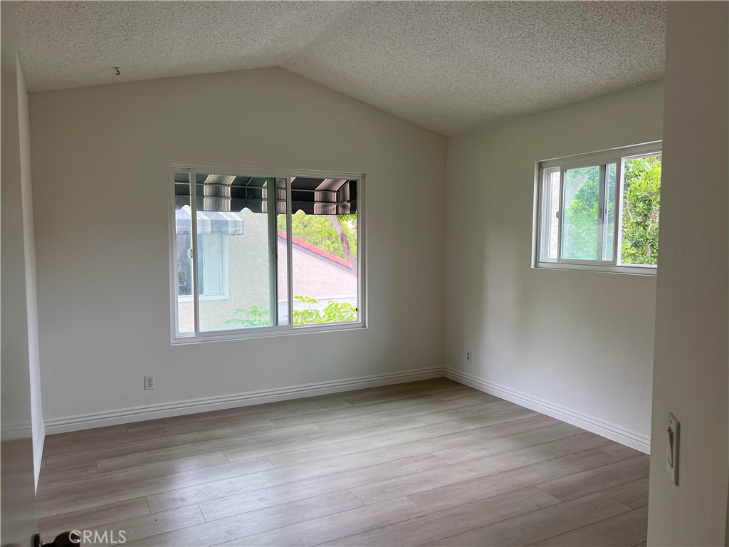 81 Stanford Court, Unit 67 Irvine, CA 92612 - Photo 25 of 30 an empty room with a window