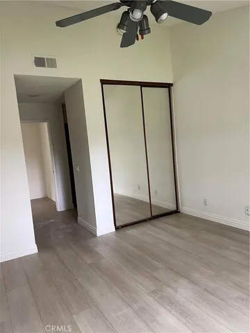a bathroom with a double vanity sink toilet and mirror