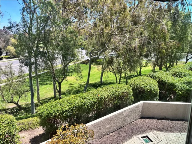 a couple of cars parked in front of a yard