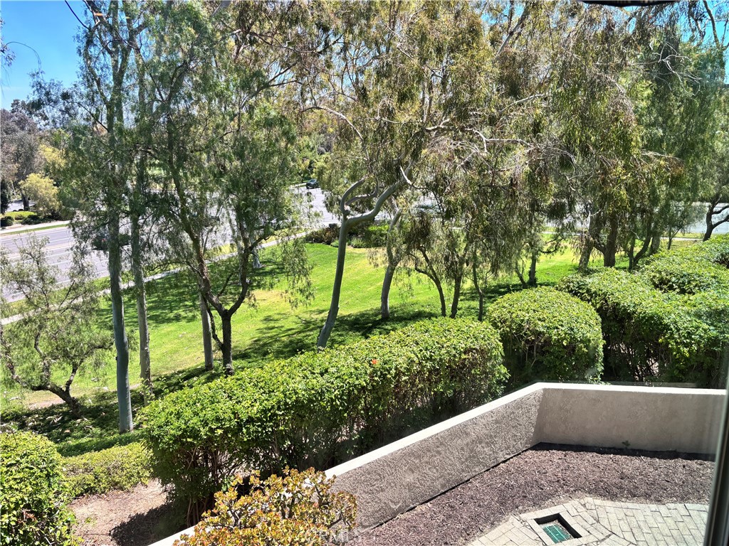 81 Stanford Court, Unit 67 Irvine, CA 92612 - Photo 6 of 30 a couple of cars parked in front of a yard