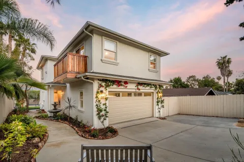 a front view of a house with parking