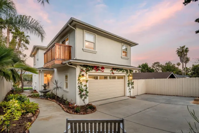 a front view of a house with parking