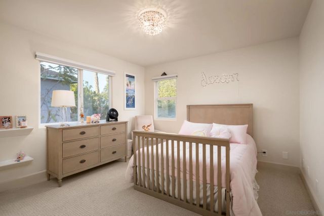 a bed room with a bed and a dresser