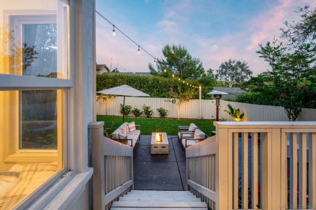 a view of a balcony with furniture