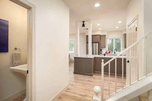 a view of entryway with kitchen