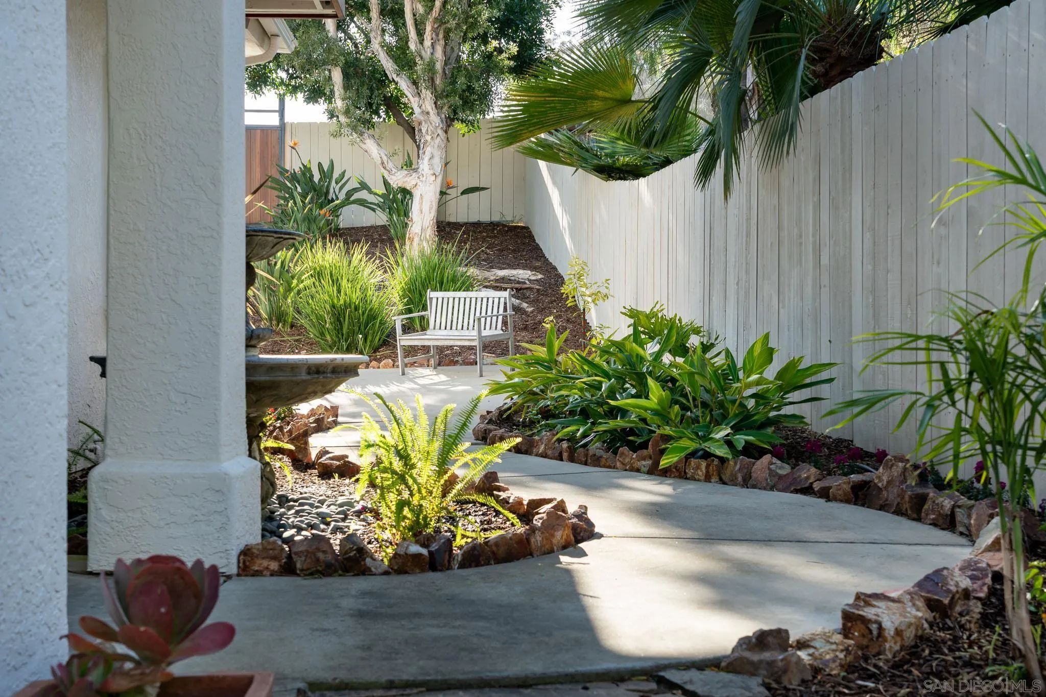 339 Rancho Santa Fe Road Encinitas, CA 92024 - Photo 36 of 36 a wooden floor with some plants and flowers