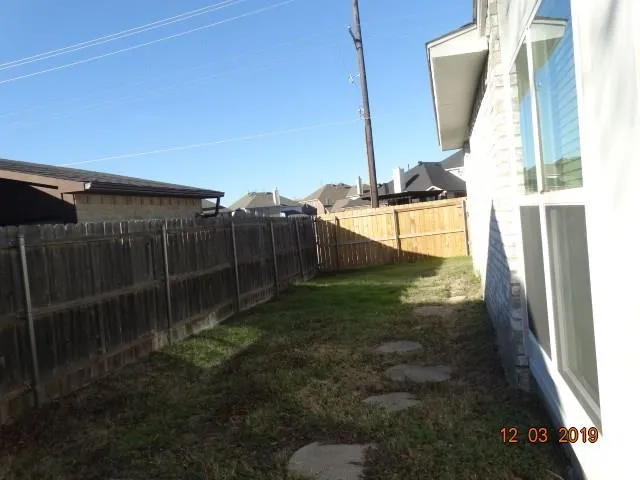 a kitchen with a refrigerator stove and microwave