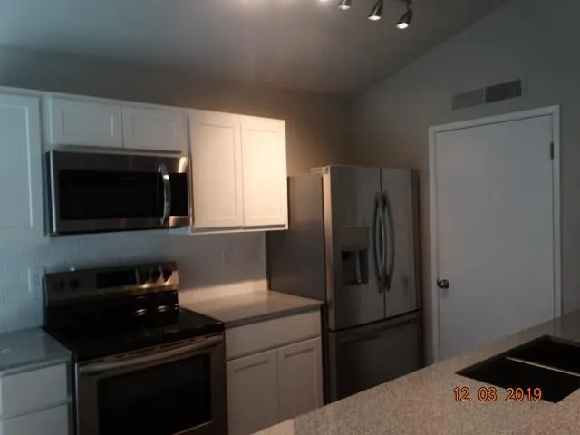 a view of an house with backyard space