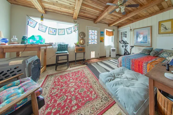a bedroom with furniture and a window