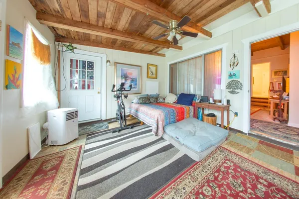 a living room with furniture and a rug