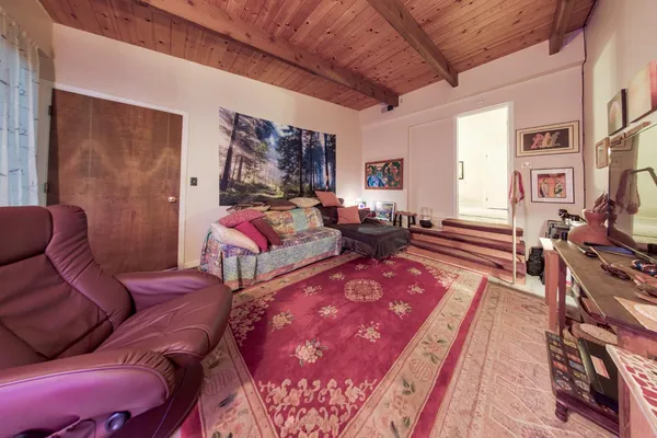 a living room with furniture or couch and a flat screen tv