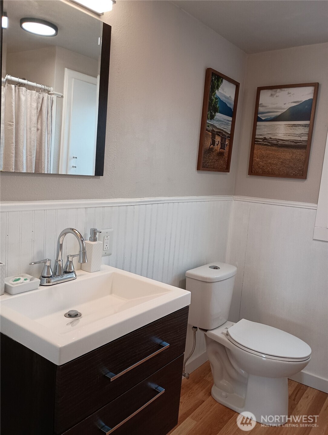 14607 Union Avenue Southwest Lakewood, WA 98498 - Photo 11 of 40 a bathroom with a toilet a sink and mirror