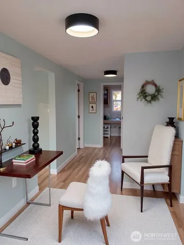 a bedroom with furniture and a chair