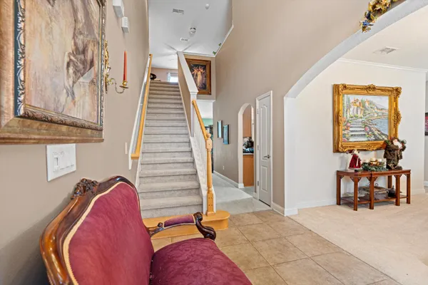 a view of a living room and entryway