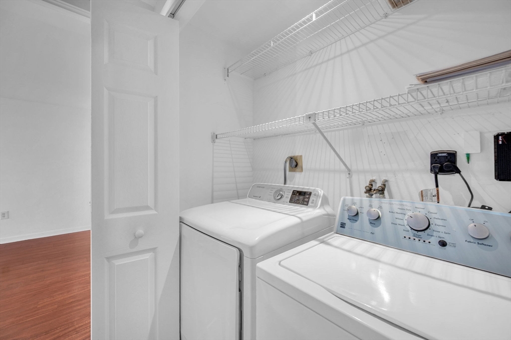 1 Commodore Court, Unit 202 Hull, MA 02045 - Photo 23 of 35 a utility room with dryer and washer
