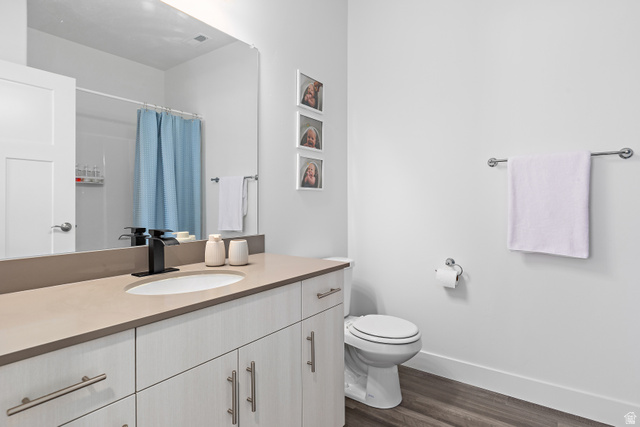 4735 Alder Drive, Unit F101 Mapleton, UT 84664 - Photo 21 of 30 Full bathroom with vanity, curtained shower, and dark wood-style floors