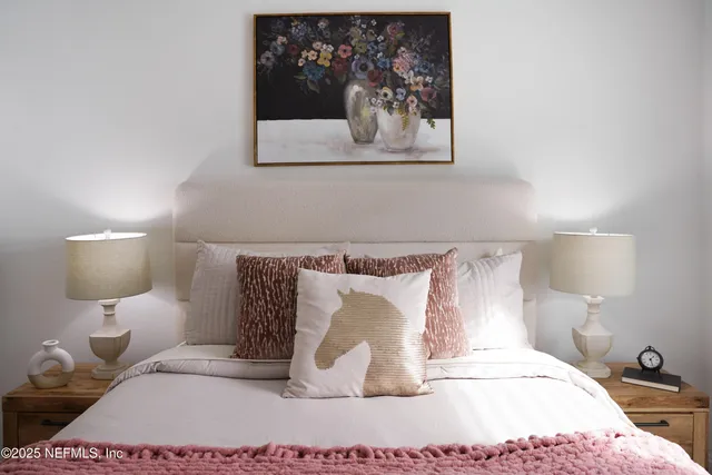 a room with a bed and a lamp on table