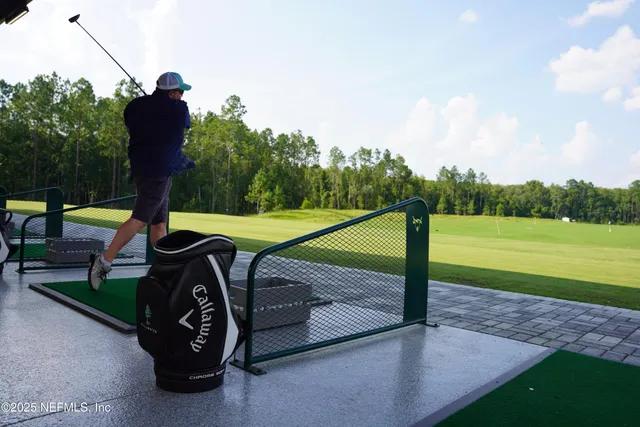a view of a backyard with sitting area