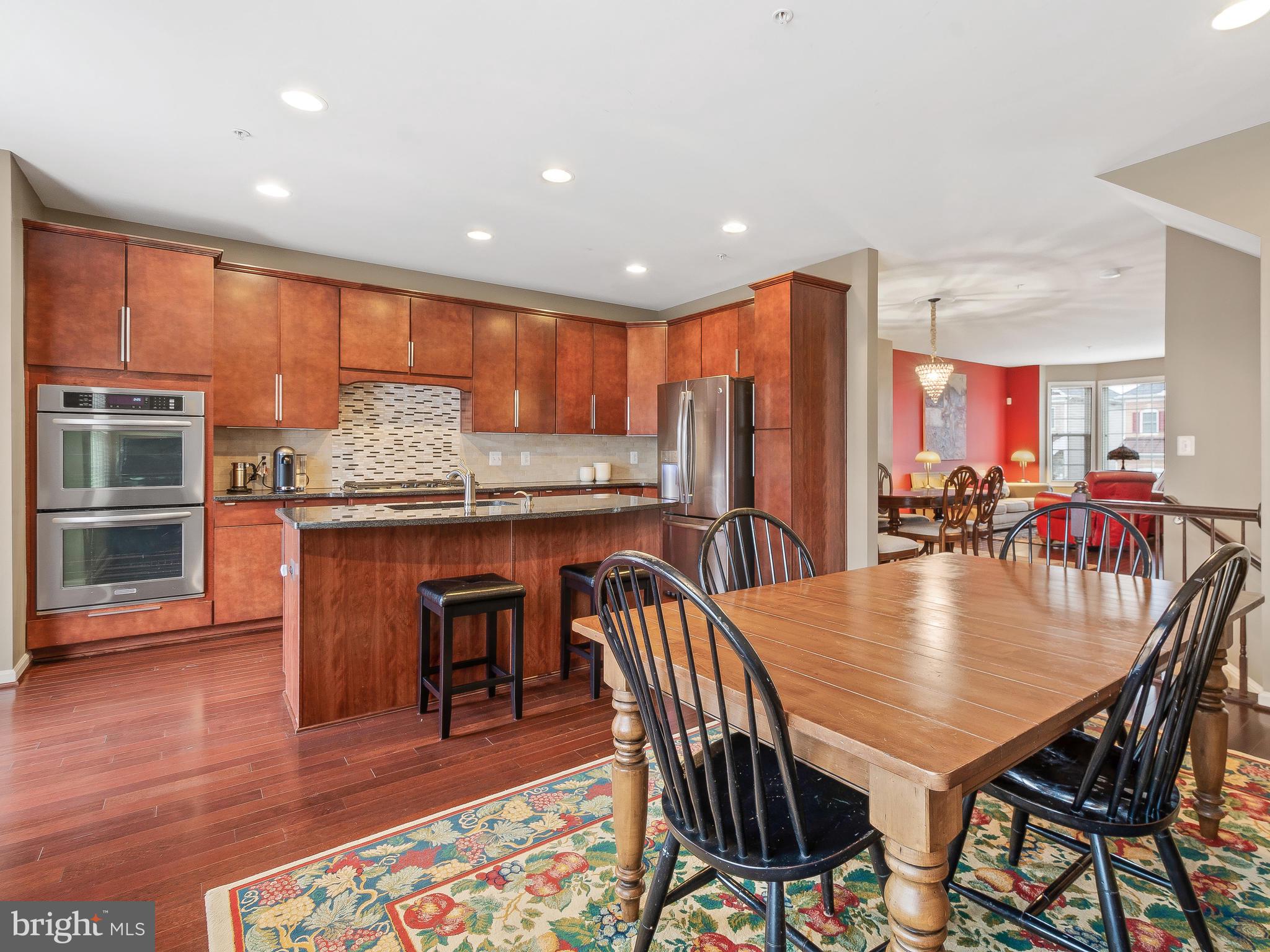 13610 Stargazer Lane Silver Spring, MD 20906 - Photo 19 of 43 a view of a dining room with furniture and wooden floor