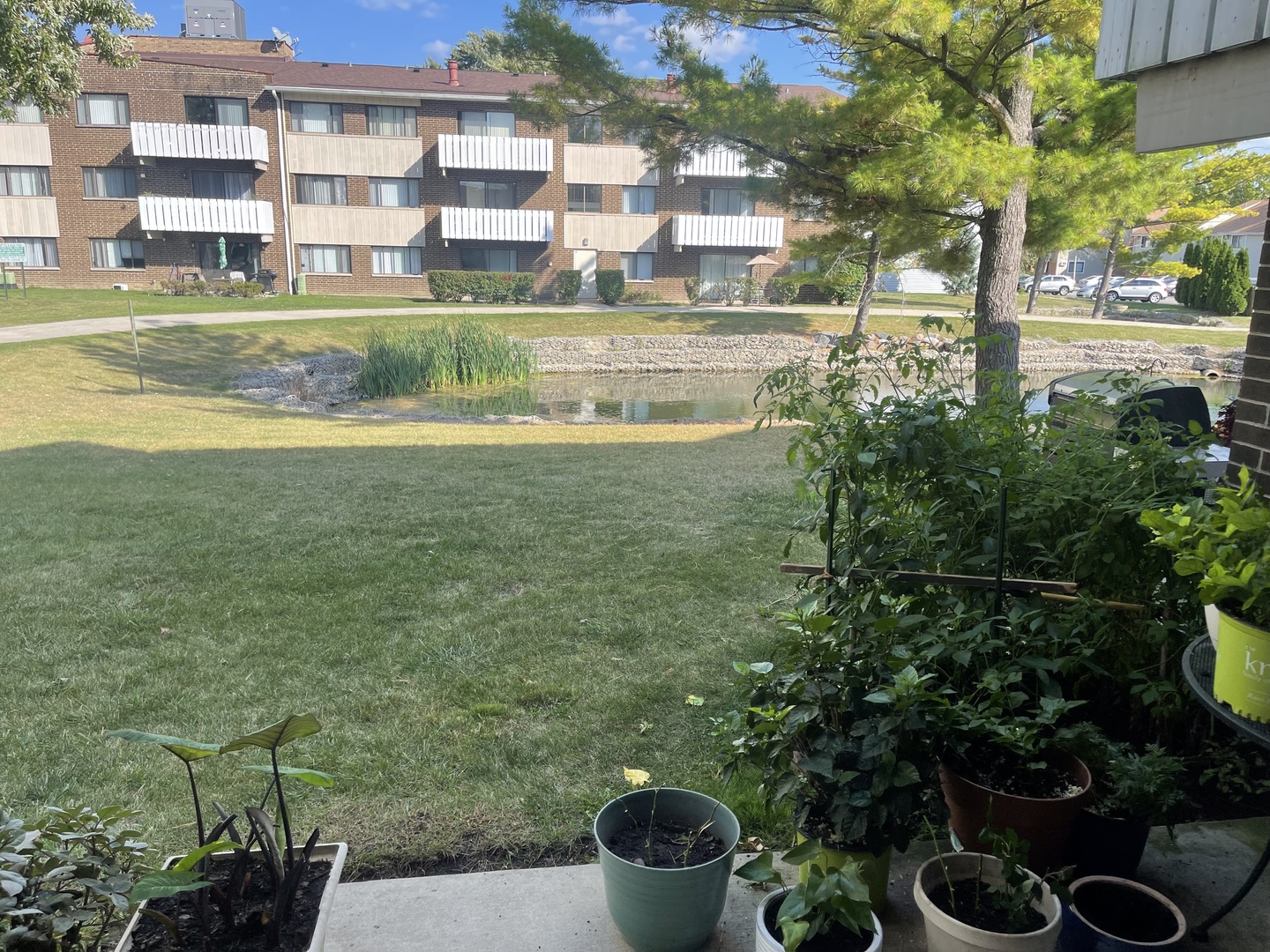 2500 Bayside Drive, Unit 3 Palatine, IL 60074 - Photo 3 of 14 a view of a house with a backyard and fountain