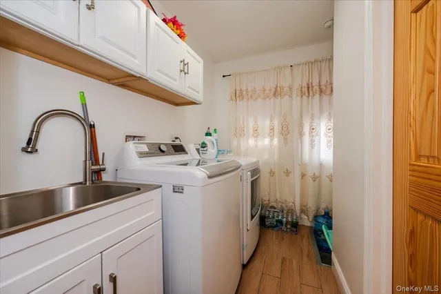 a kitchen with a sink and a refrigerator