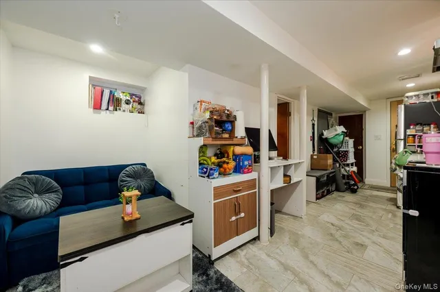 a view of a livingroom with furniture and workspace