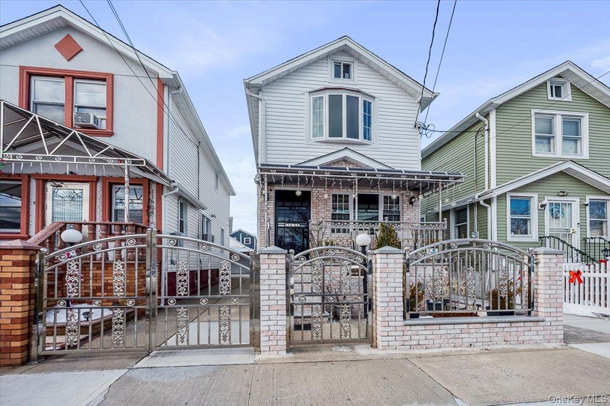 116-22 127th Street Queens, NY 11420 - Photo 18 of 18 front view of a house with a street