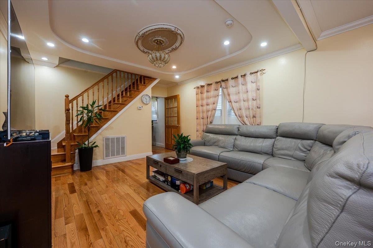116-22 127th Street Queens, NY 11420 - Photo 4 of 18 a living room with furniture and wooden floor
