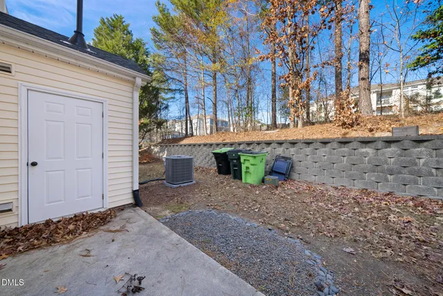 a view of a house with a yard and sitting area