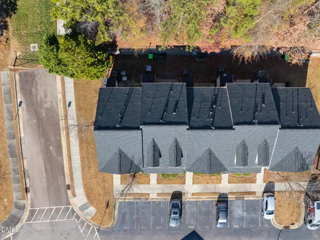 a view of backyard with swimming pool and seating space