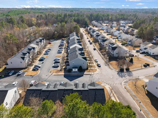 an aerial view of house with yard