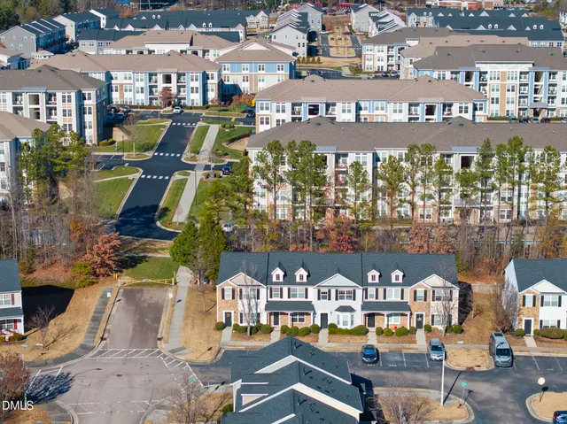a view of multiple houses with yard