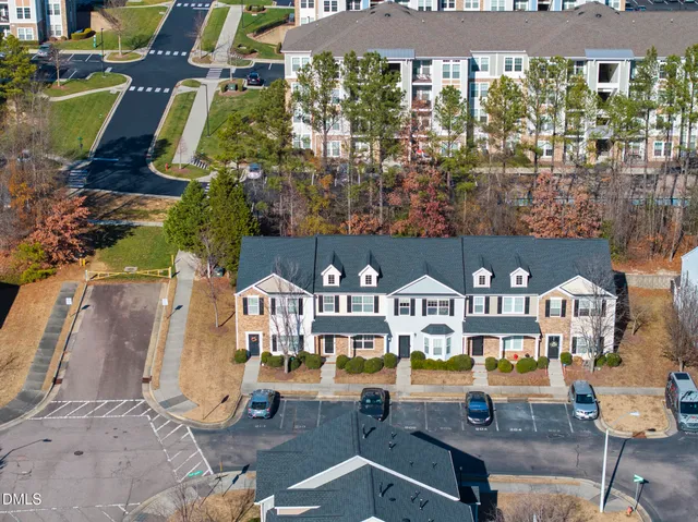 an aerial view of residential houses with outdoor space
