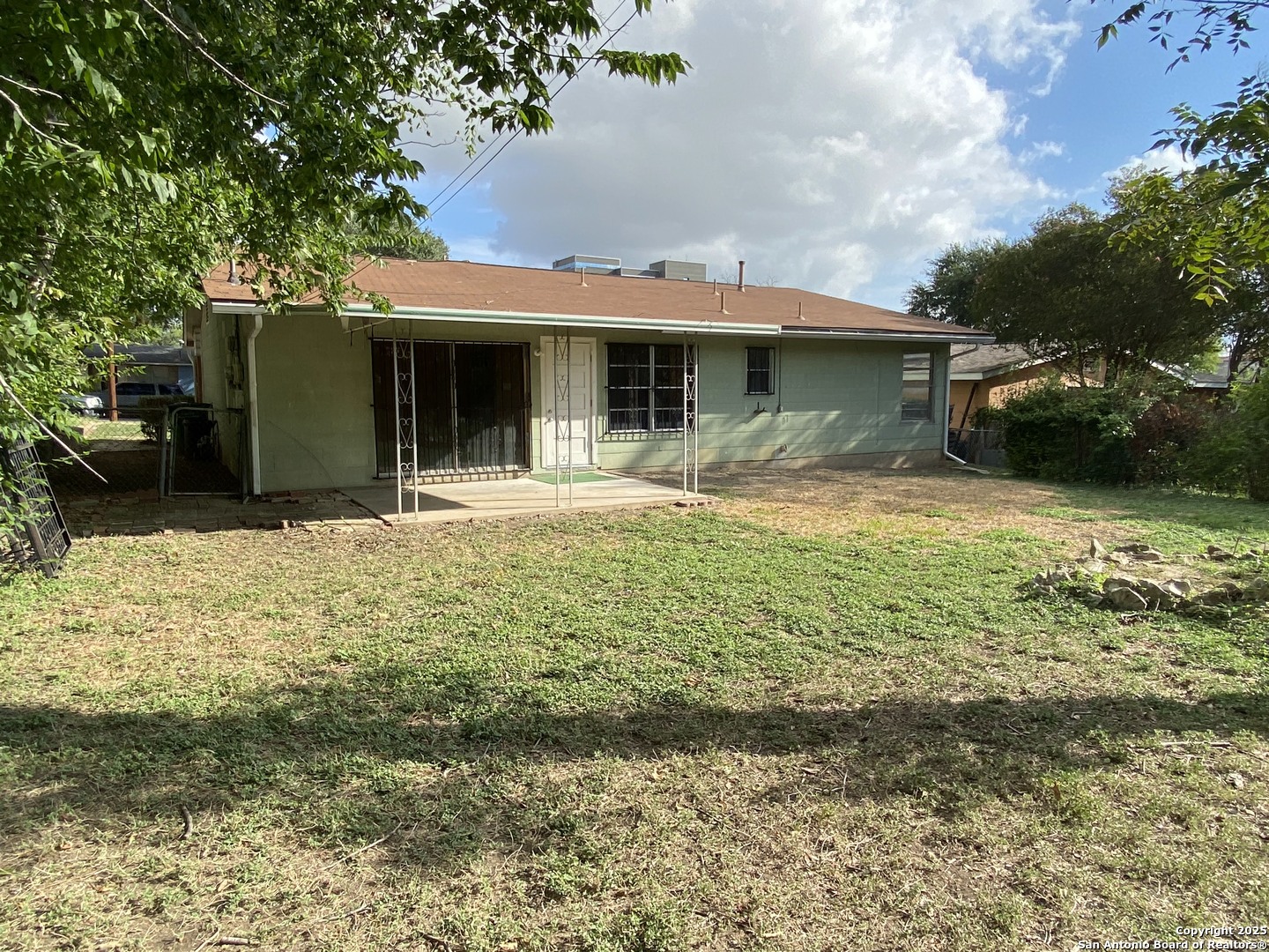 618 East Rector Street San Antonio, TX 78216 - Photo 5 of 24 a front view of a house with a yard and garage