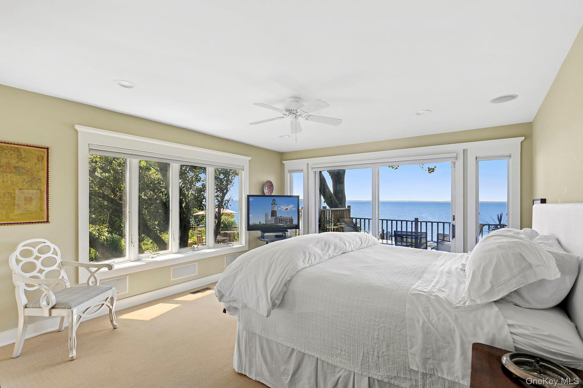 29 Bittersweet Lane Sag Harbor, NY 11963 - Photo 11 of 20 a bedroom with a large bed and a large window