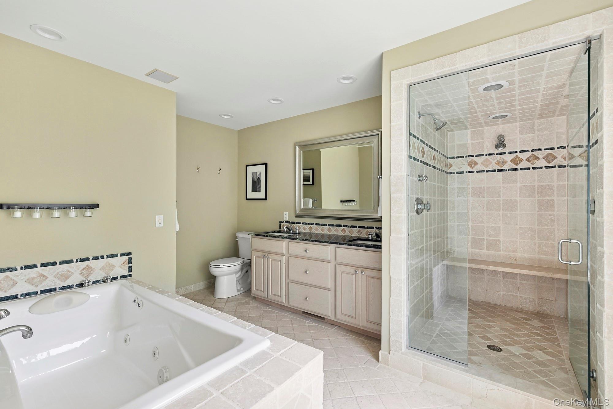 29 Bittersweet Lane Sag Harbor, NY 11963 - Photo 12 of 20 a bathroom with a tub sink mirror and toilet