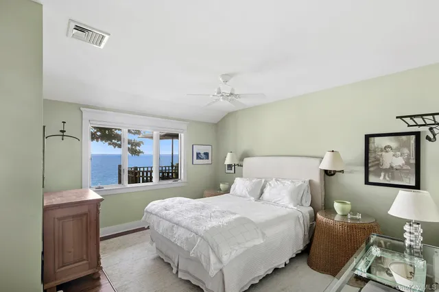 a bedroom with a large bed and a couch