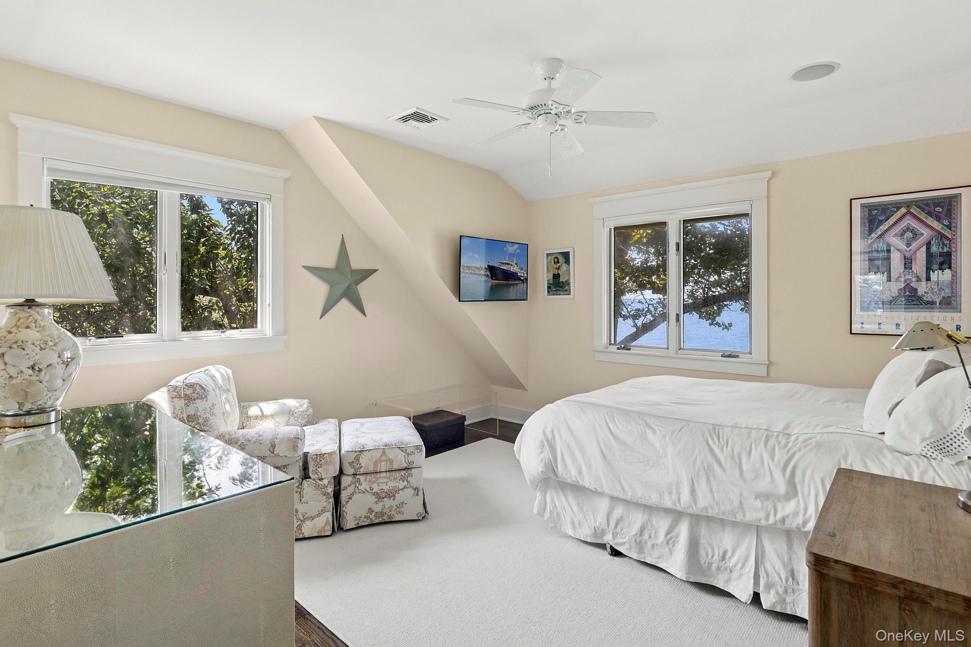 29 Bittersweet Lane Sag Harbor, NY 11963 - Photo 18 of 20 a bedroom with a large bed and a window