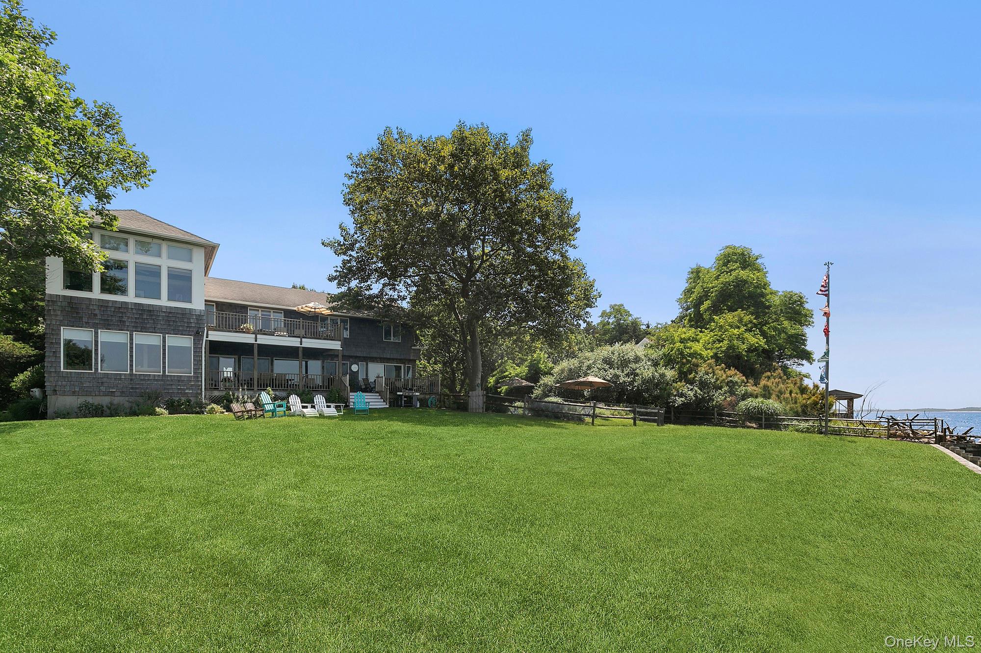 29 Bittersweet Lane Sag Harbor, NY 11963 - Photo 2 of 20 a view of a building with a yard