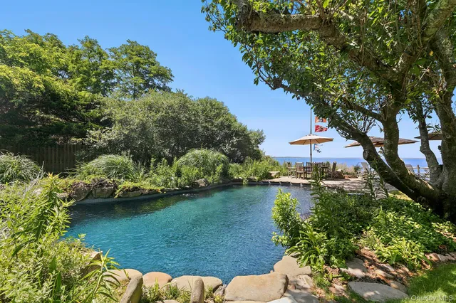 a view of a house with a yard and a garden
