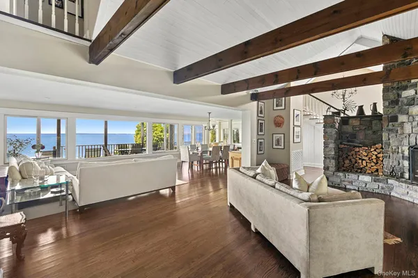 a living room with furniture and a floor to ceiling window