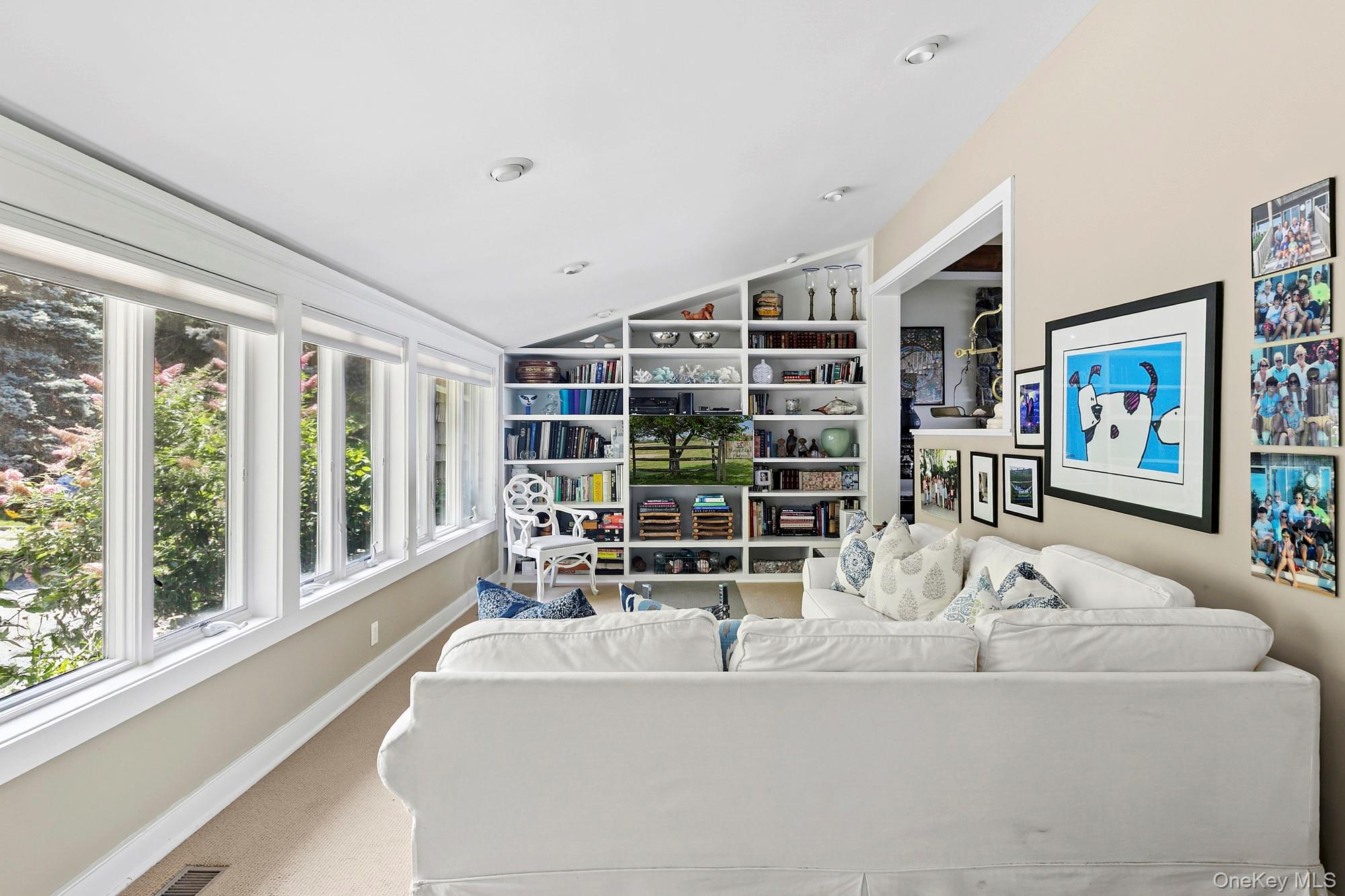 29 Bittersweet Lane Sag Harbor, NY 11963 - Photo 9 of 20 a living room with furniture and large windows