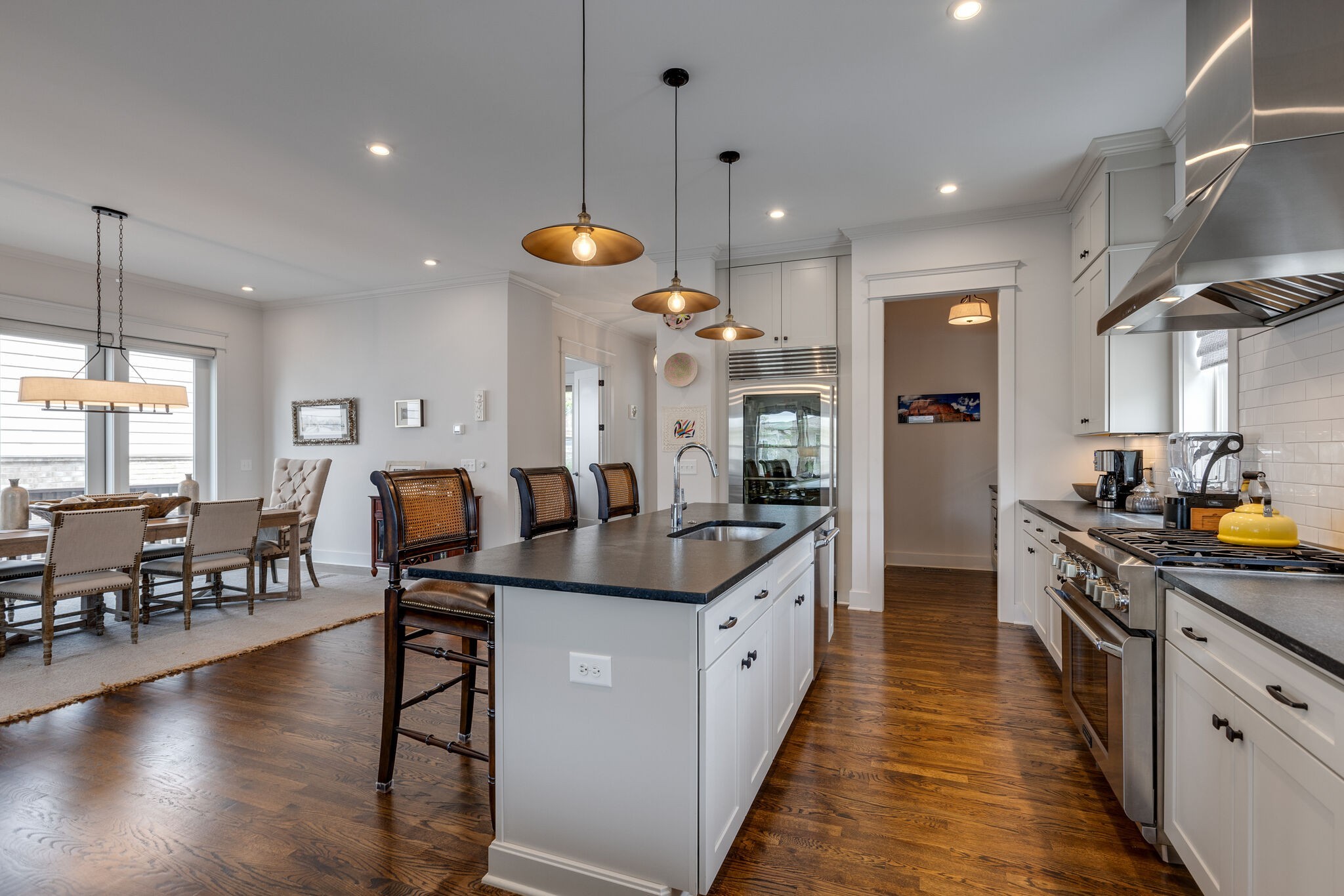 3406 Love Circle Nashville, TN 37212 - Photo 12 of 40 a large kitchen with lots of counter space dining table and chairs