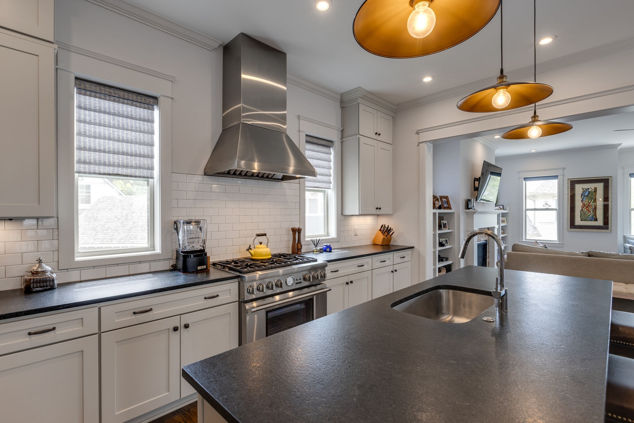 3406 Love Circle Nashville, TN 37212 - Photo 13 of 40 a kitchen with stainless steel appliances granite countertop a stove a sink and a microwave